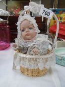 A musical moving doll in basket.