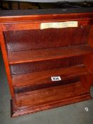 A mahogany shelf unit. (collect only)