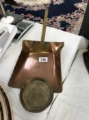 An old brass and copper shovel.