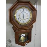 A battery wall clock in working order. (Collect only)