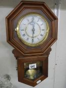 A battery wall clock in working order. (Collect only)
