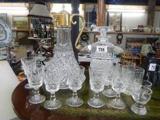 A Decanter, a claret jug and glasses. (Collect only).