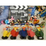 A collection of Disney figures etc., including Mickey Mouse.
