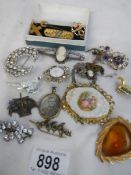A mixed lot of costume jewellery, brooches etc.,