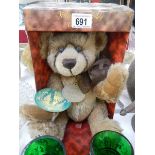 A boxed Millenium collector's bear.