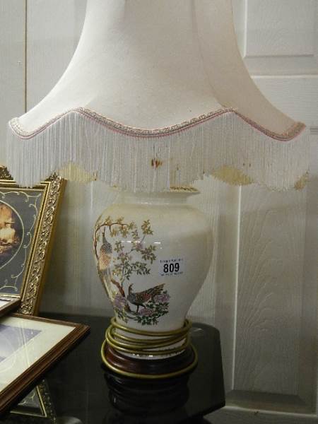 An oriental style table lamp. (collect only).