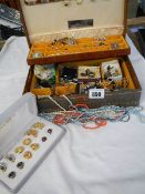A jewellery box containing earrings, brooches, necklaces etc.,