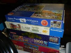 A quantity of jigsaw puzzles.