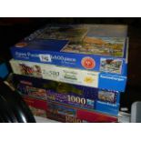 A quantity of jigsaw puzzles.