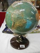 A Globe of the world with raised countries. (Collect only)