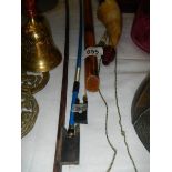 Two violin bows, a wooden flute and a bone horn.