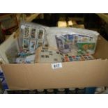 A box of assorted stamps/ cigarette cards etc.,