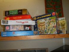 A mixed lot of jigsaw puzzles.