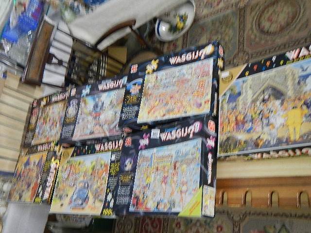 Seven Wosgij jigsaw puzzles.