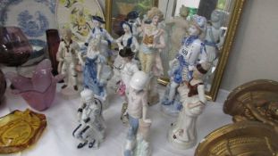 A mixed lot of male and female figures.