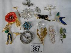 A mixed lot of brooches including animals.