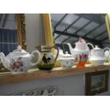 Four collectable teapots and a Totnes jug.