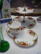 A Royal Albert Old Country Roses cake stand and tea cup with sandwich plate.