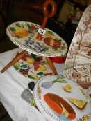 A retro style cake stand and a cheese plate.
