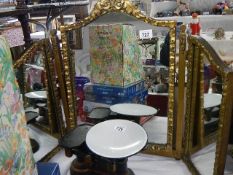 A gilt framed triple dressing table mirror. (Collect only)