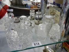 A mixed lot of glass condiment bottles etc.,