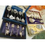 A mixed lot of cased and boxed spoons.