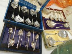 A mixed lot of cased and boxed spoons.