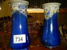 A pair of Royal Doulton vases.