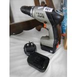 A Black and Decker cordless drill.