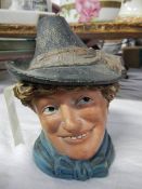 A Victorian tobacco jar in the form of a head.