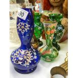 Five hand painted coloured glass vases.