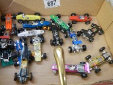 A mixed lot of die cast racing cars.