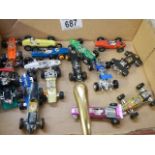 A mixed lot of die cast racing cars.