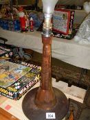 A wooden table lamp base.