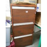 A wood effect three drawer filing cabinet, (Collect only).