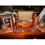 A mixed lot of wooden items including candlesticks, book ends etc.,
