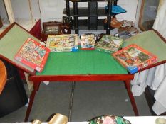 A jigsaw puzzle table and jigsaw puzzles. (collect only).