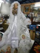 A superb quality porcelain winter bride collector's doll and one other (collect only)