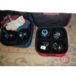 Two sets of lawn bowls in bags. (Collect only)