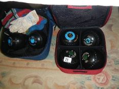 Two sets of lawn bowls in bags. (Collect only)