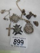 Approximately 30 grams of silver including fobs, cross, pendant etc.,