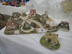 A cottage diorama and two cottages.