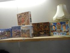 A quantity of jigsaw puzzles.