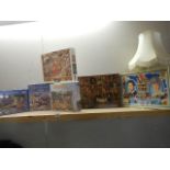 A quantity of jigsaw puzzles.