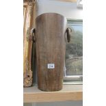 A tall wooden vase with handles. (Collect only)