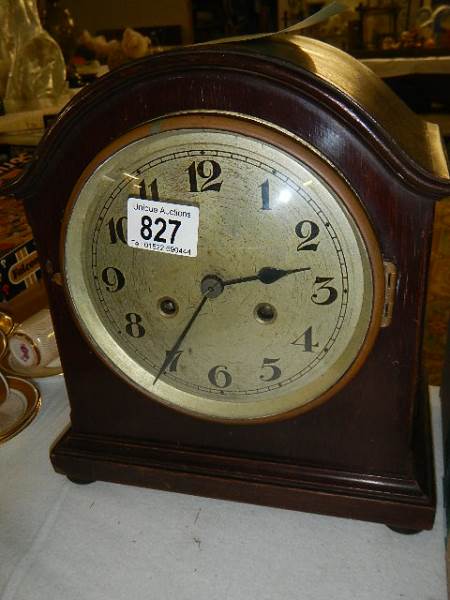 A mahogany 8 day mantel clock.