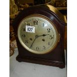 A mahogany 8 day mantel clock.