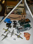 A mixed lot of die cast cars, aircraft etc.,