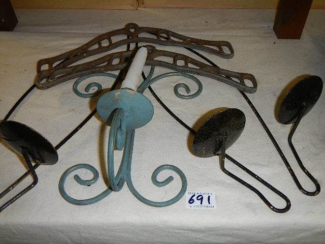 Three metal wall candle holders and two metal brackets.