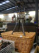 A large wicker basket and a small wicker pot stand.